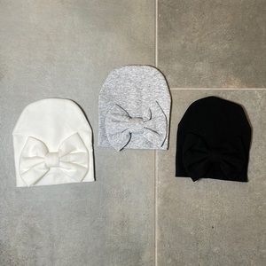 Never worn, like new newborn hats with bows